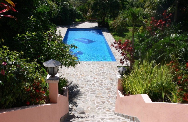 Private villa with lush tropical garden and big heated pool