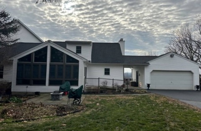 Quaint Cape Cod attached home nestled atop a hill near Speedwell Forge Lake
