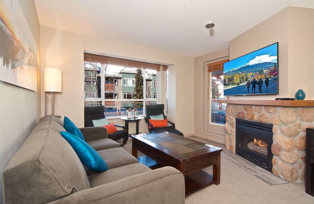 Relax and Watch the activity of the Village on the oversized patio. Professionally Managed.