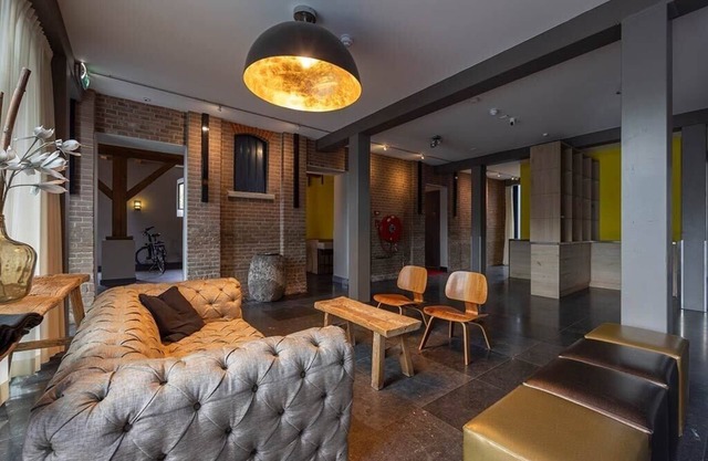 Relish Modern Comforts in Historic Grain Warehouse Near Plopsa Indoor