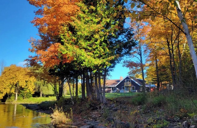Remodeled lodge on 73 acres with 1/2 mile riverfront in Michigan's UP wilderness