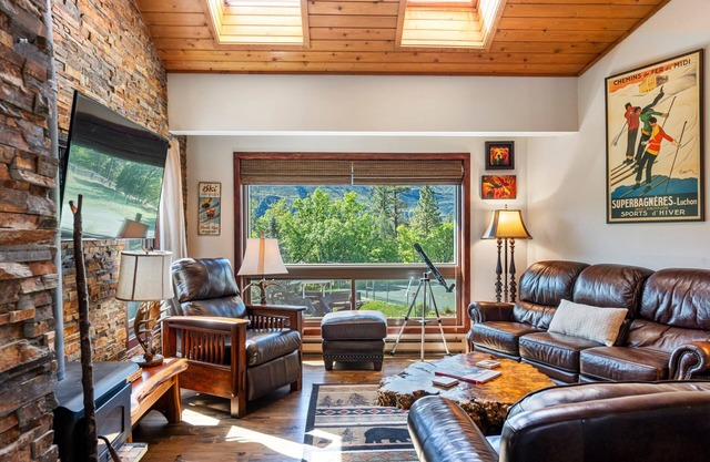 Renovated condo with woodstove, 2 balconies, W/D & view of railroad