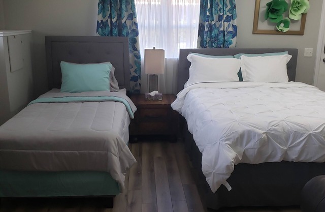 Renovated Suite with 1 queen bed and a Twin. Kitchen & bath for your privacy.