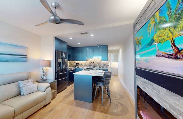 Renovated Sunset Beach Waterfront Condo with Water Views, Pool, Fishing Dock & Beach Access.