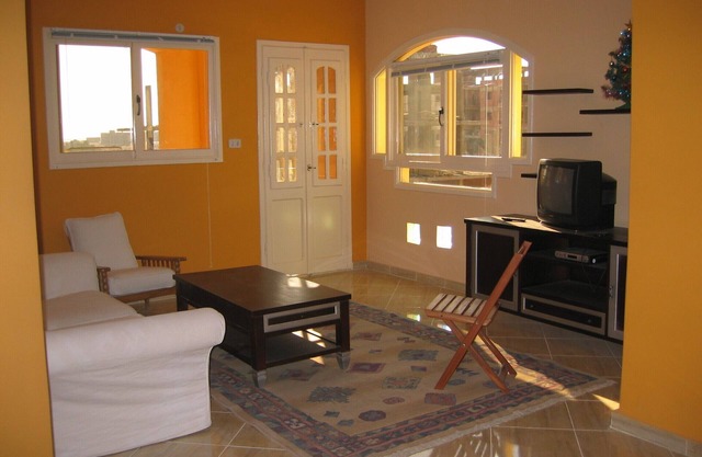 Residential flat in private building up to our house
