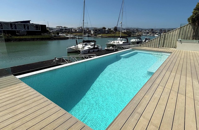 Resort style waterfront living - waterfront swimming pool and private jetty.