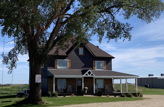 Restored farmhouse sits atop 54 acres with 360 degree views of picturesque WI.