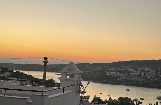 Romantic hillside villa with stunning views, community beach and pool