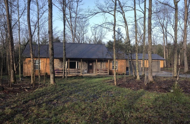 Rustic Cabin with modern amenities and 1 acre stocked Fishing Lake !