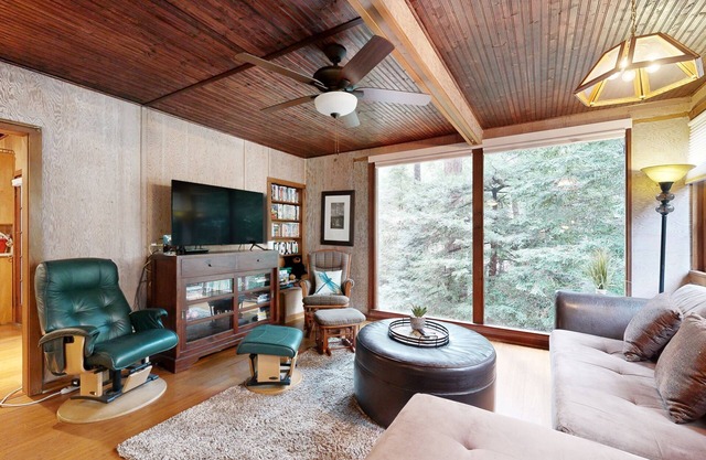 Rustic chic retreat set back among the trees with furnished deck