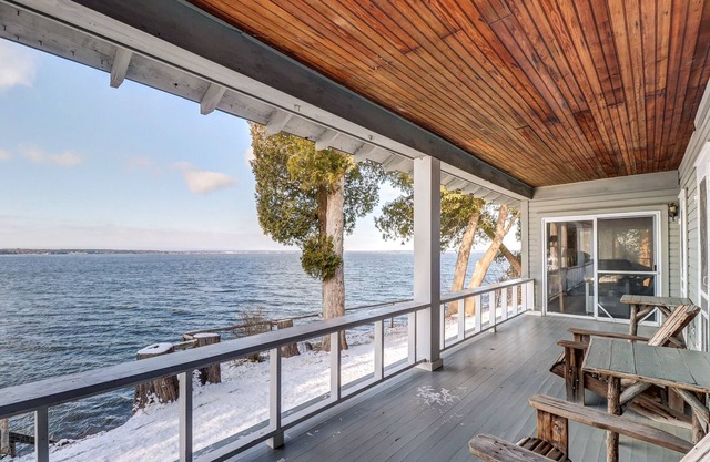 Rustic lakefront home with big porch, WiFi & easy water access