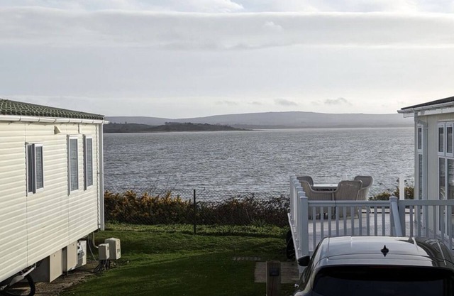 Safari Sunset caravan + sea view at Rockley Park, Poole Harbour. Dogs stay free!