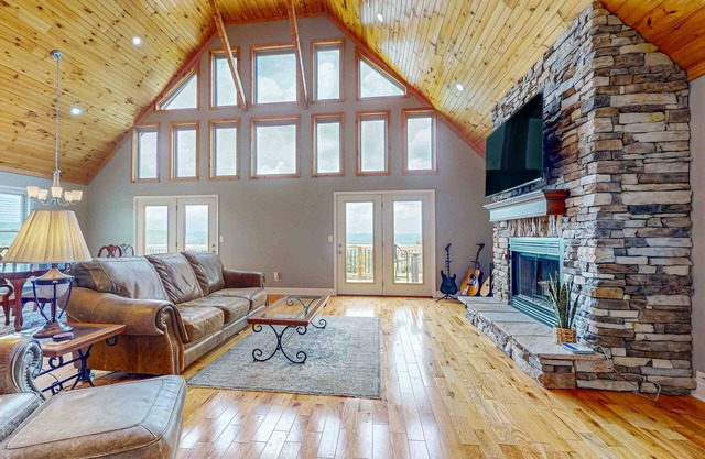 Scenic lakeview retreat with wraparound deck, vaulted ceilings & game room
