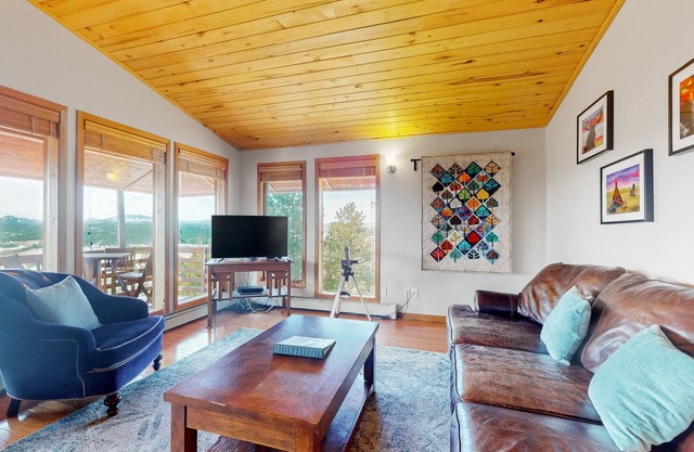 Secluded mountain-view home with expansive deck, hot tub, deck, & grill