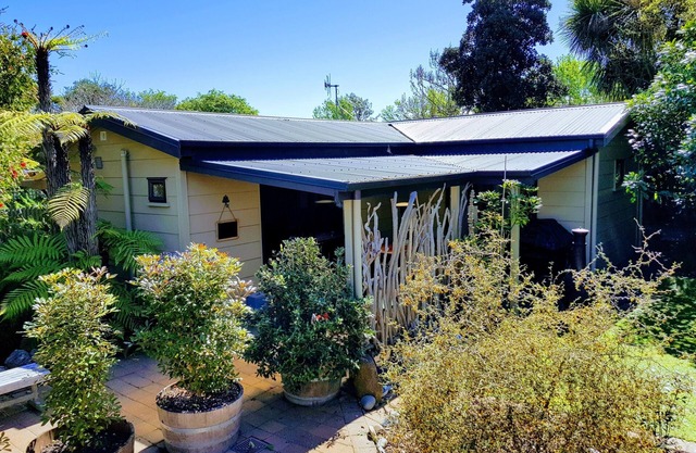 Secluded Riverside Cottage set in native garden.