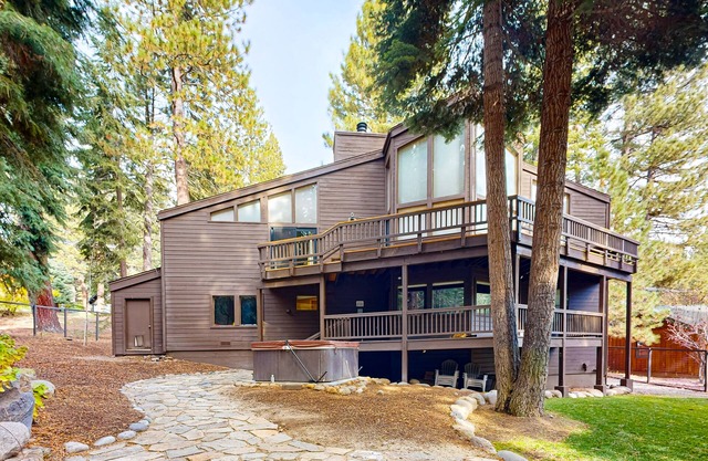 Serene home with fireplace, wood stove, kitchen, W/D, hot tub, & gas grill