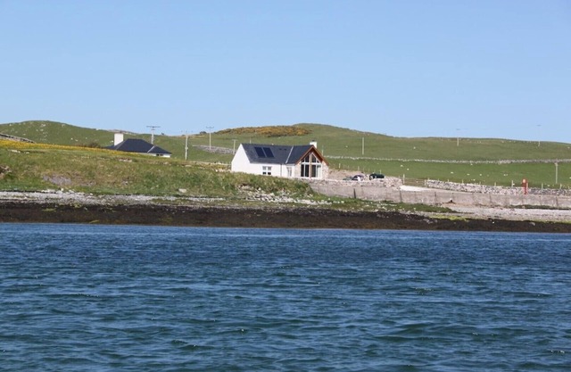 Shore Cottage -The sea and the sky become one in this gem of a cottage.
