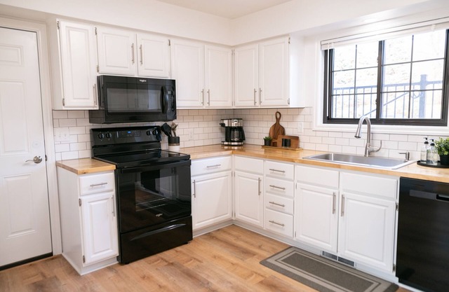 Side by side duplex w/ private driveway, yard and easy access to everything
