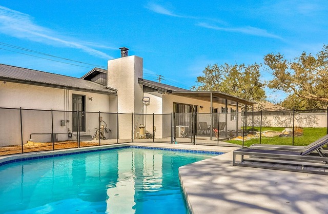Sophisticated dog-friendly home with pool, large enclosed yard, washer/dryer, AC