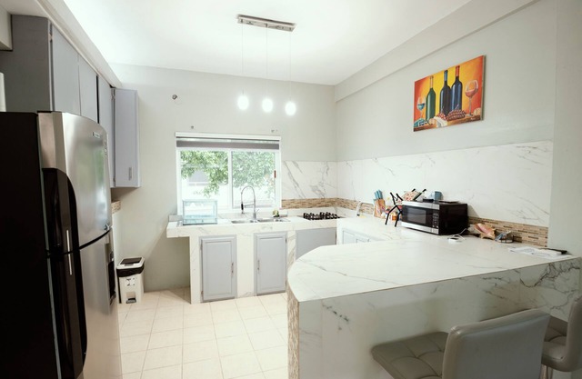 Spacious hotel suites with 8 bedrooms and WiFi, AC in charming Corozal