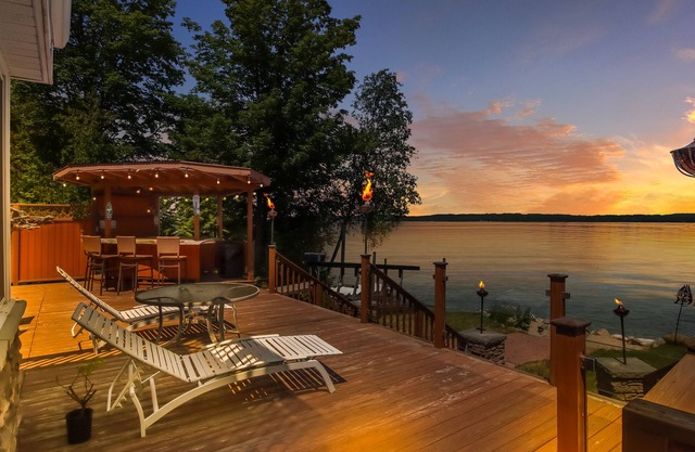 Spacious LAKE FRONT home w/100' DOCK & Hot tub on Elk Lake mins to TORCH LAKE