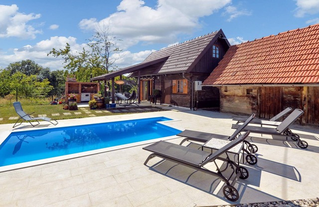 Spend a carefree vacation in this modern furnished vacation home with pool.