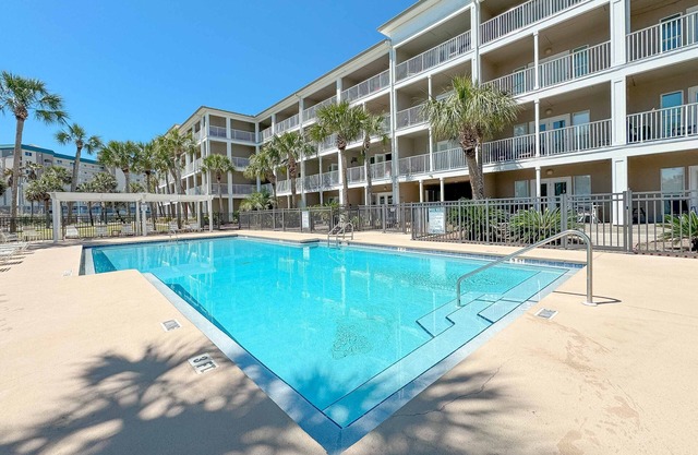 Steps to Pools, Hot Tub, Beach | Poolside Palms | Garden Level Patio & Lawn Area