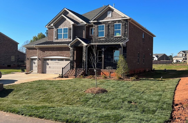 Stunning 4-bedroom spacious home with backyard and security in private community