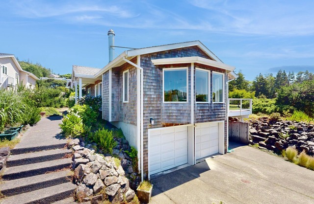 Stunning coastal home with ocean views, firepit & media room - walk to beach