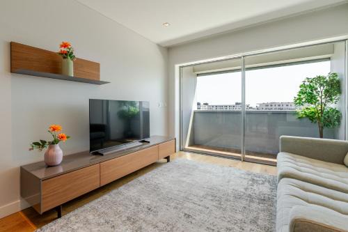 Stylish Home with Balcony & Garage by HostWise