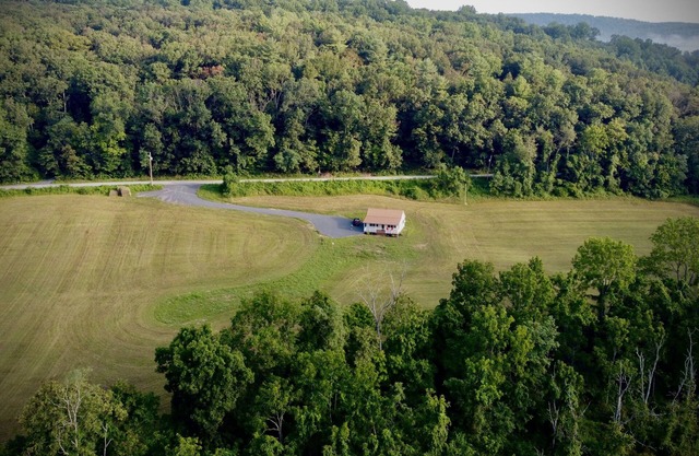 Surrounded by quiet fields and woods