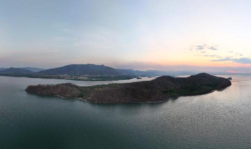 Teak house in a forest above the beach