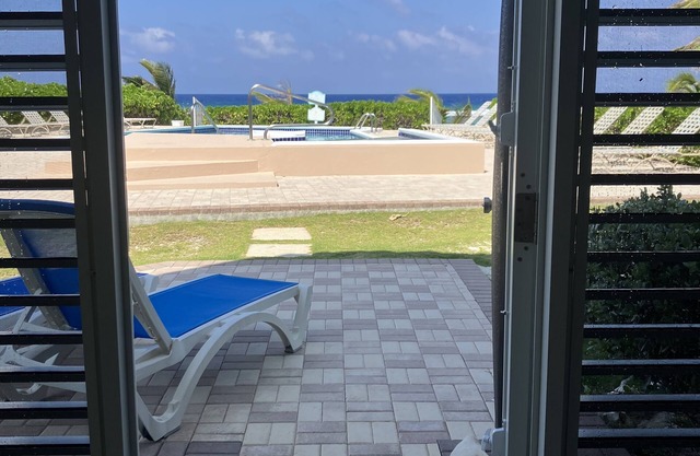 The Harvey Nicole: Modern Caribbean Ocean Front Condo Grand Cayman.