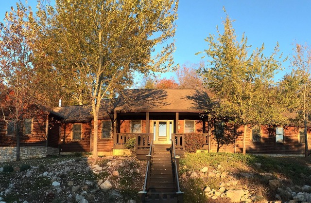 The Lodge at Harvest Moon sleeps 16 with five bedrooms and unique private Pub