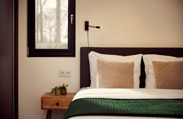 The luxurious two-person hotel studio with a beautiful patio, high windows and sliding doors offers a surprising amount of privacy, space and comfort.