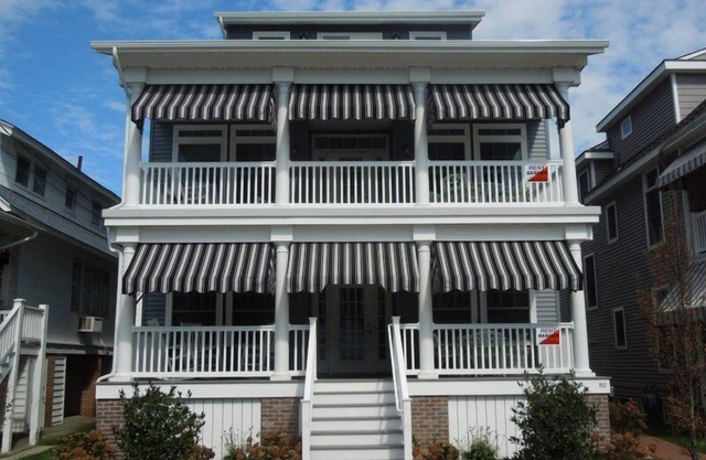 This 5 bedroom, 4 bath 2nd floor unit sleeps 12 and is one block from the beach