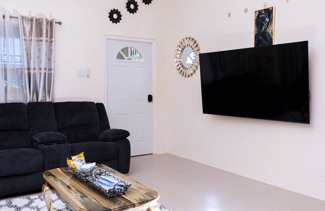 This cozy home is ten minutes from the turquois waters of the Caribbean sea.