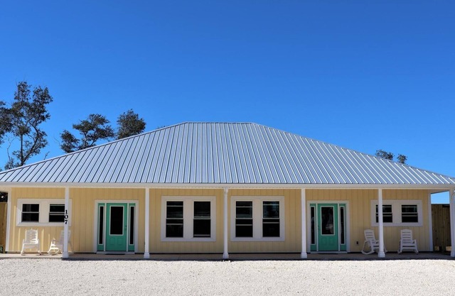 THIS DUPLEX IS PERFECT FOR LARGE FAMILIES/MULIIPLE FAMILES! STEPS AWAY FROM THE BEACH