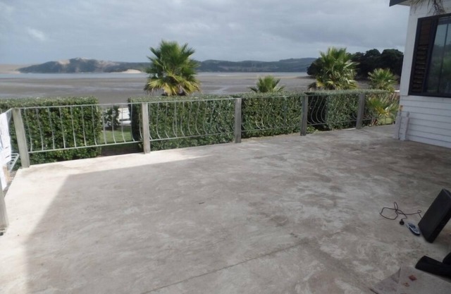 This is the one, pristine kiwi bach by the water!