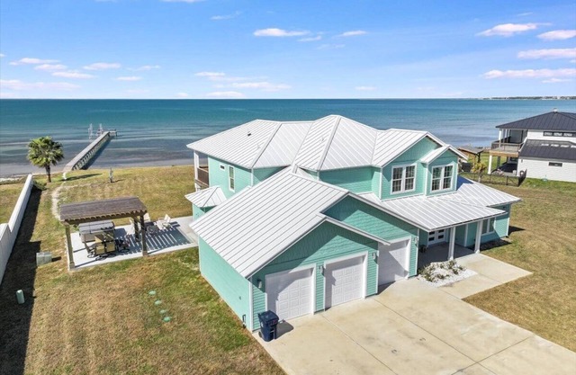 This is your dream house! 2 acres, guest house, beach, pier, hottub and more!