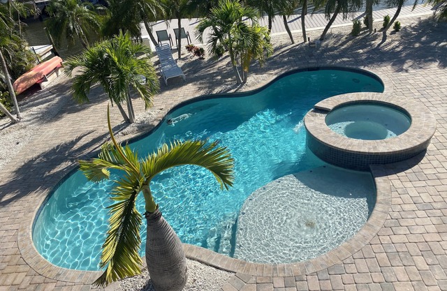 Times Square Gem! 4BR Canal front home, private Pool/Spa, Sleeps 12