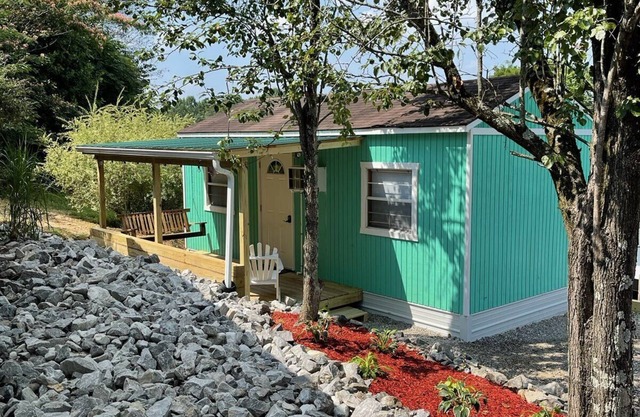 Tiny house with deck and swing