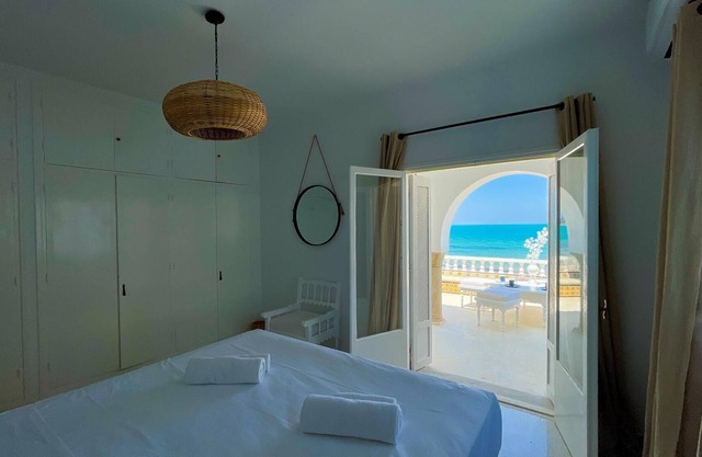 The Sea House beach front villa with pool