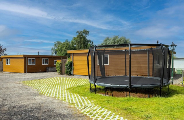 Two large chalets side by side with two sloops