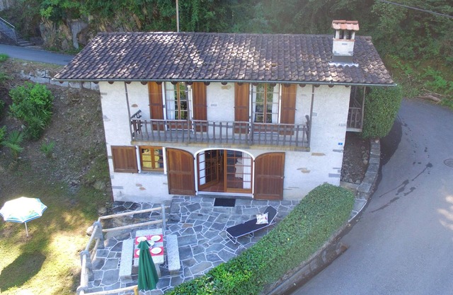 Typical Ticino house in an elevated position in Gambarogno