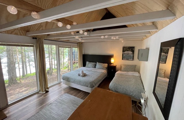 Updated historic log cabin on the lake, w/amenities enough for 2 families