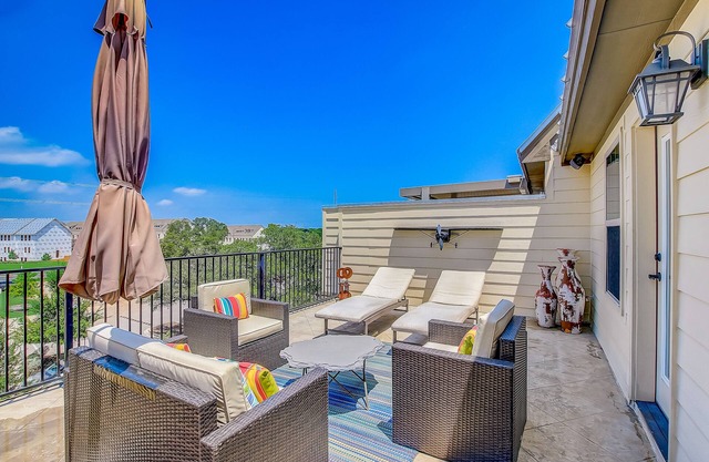 Upscale four-story townhome next to park with elevator, rooftop terrace, & WiFi