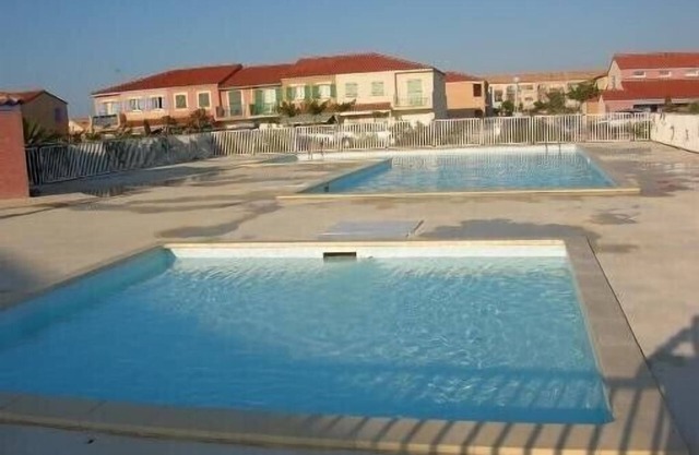 View over pond. Air-conditioned house located in a quiet estate.