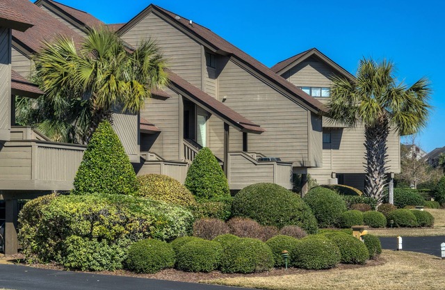 Villa with marsh views and pool access located within gated Litchfield By the Sea community.