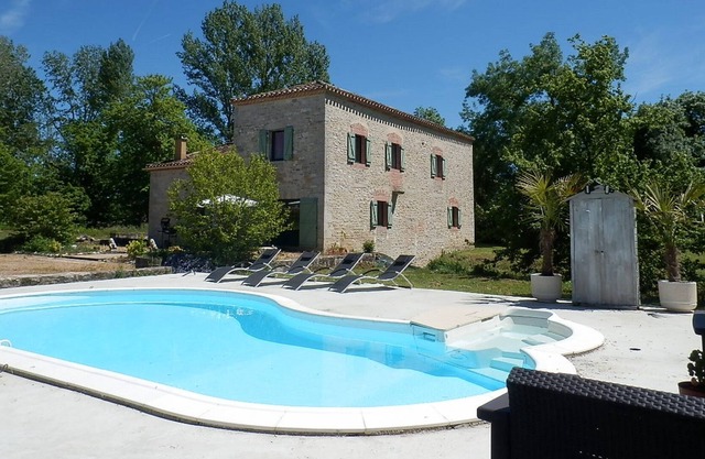 Water mill with swimming pool, waterfall, and stream